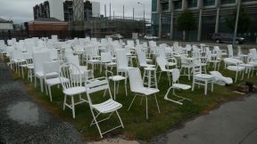 The chairs represent the 182 people that got killed.